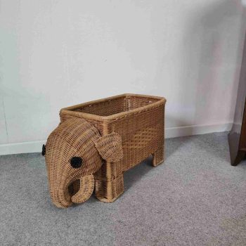 Vintage Italian handwoven rattan elephant magazine rack, front view. Natural view.