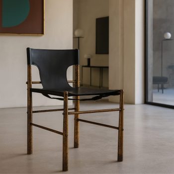 Vintage Italian brass and black leather chair, Mid-Century Modern style, Italy, 1970s.