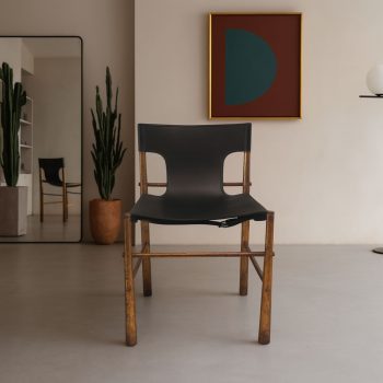 Vintage 1970s Italian brass chair with black leather seat and back, front view.