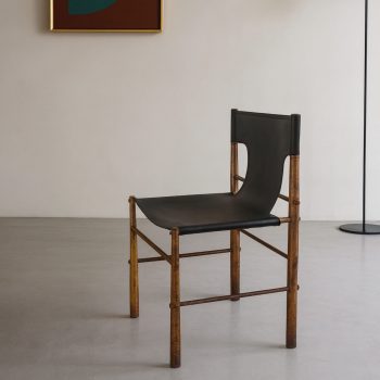 Italian brass and leather chair, side view, vintage 1970s design.