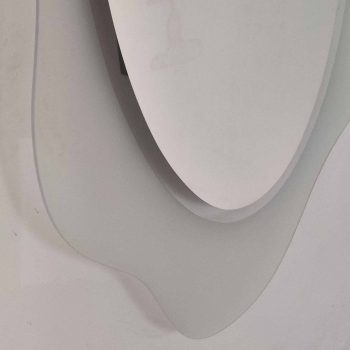 Lower detail of the shaped edge of the Glas Italia Round 160 mirror, satin and silver finish.