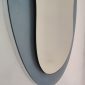 Lower detail of the Veca mirror, shaped glass with a three-dimensional effect